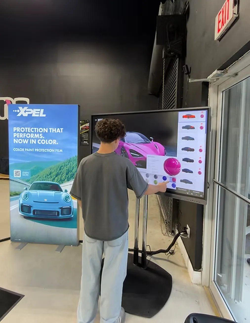 An XPEL colour paint-protection-film display screen in the shop